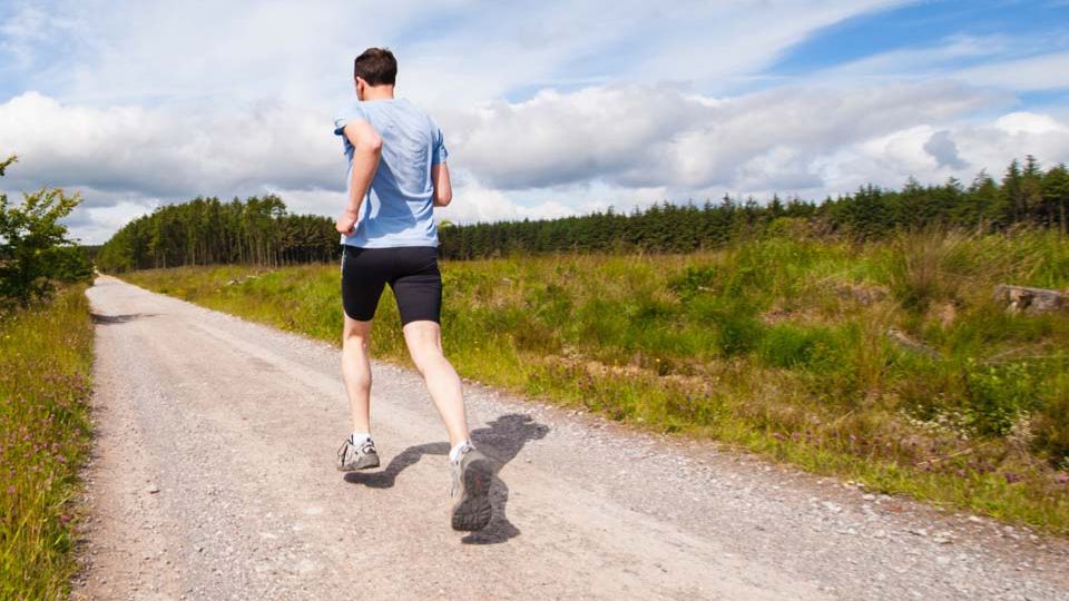 Man running on country road
