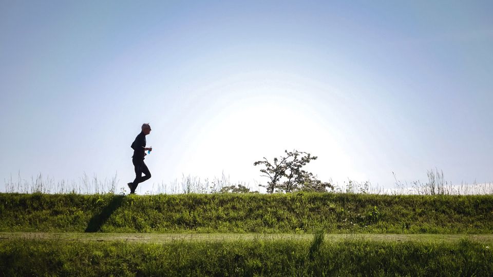 Solo runner in shadow