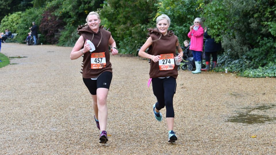 Two female runners in themed outfits at the Hedgehog Half Marathon