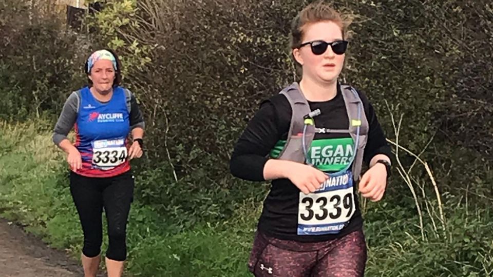 Runners braving the wind at the Bamburgh 10K and Castles Half Marathon