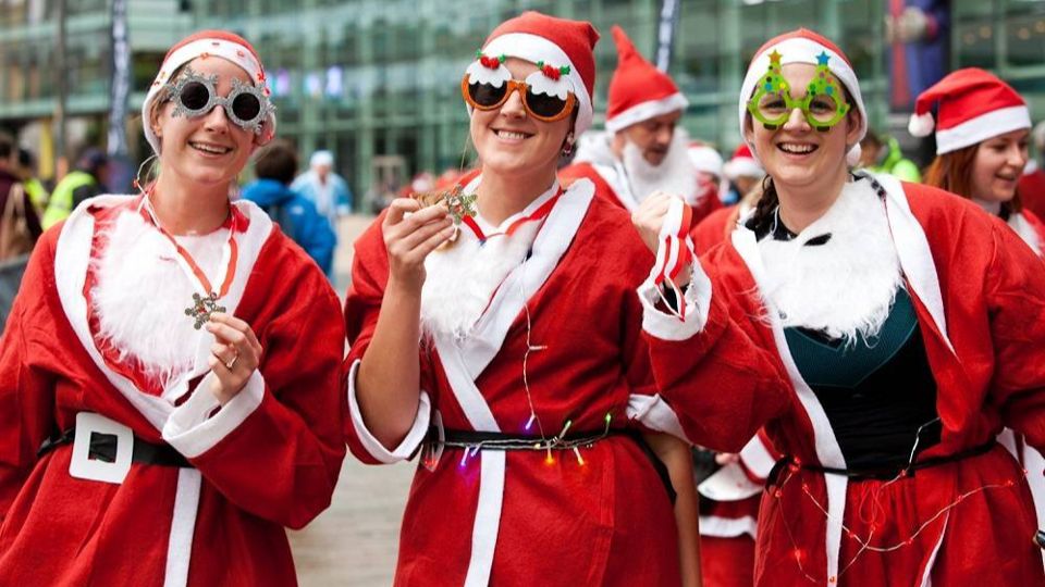 Runners with their medals at the Jingle Bee Jog