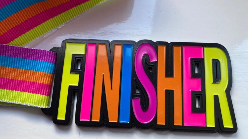 Brightly coloured finisher medal for March virtual 5K challenge