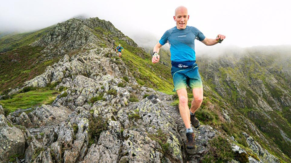runner descending on hills