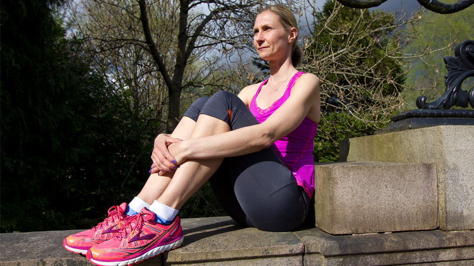Christine Appel sits on bridge