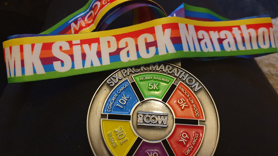 /images/2021/07/six-pack-marathon-medal.jpg
