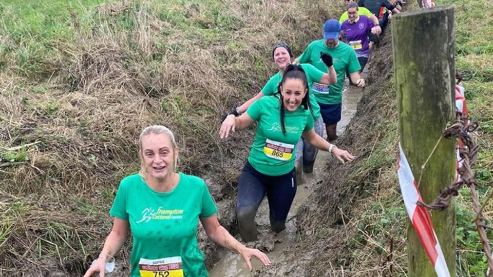 Runners in the mud and water at the Sodbury Slog 10 mile race