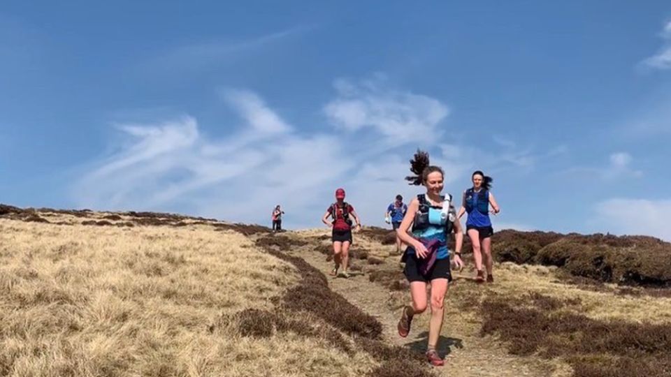 Runners enjoying the views in the Peak District