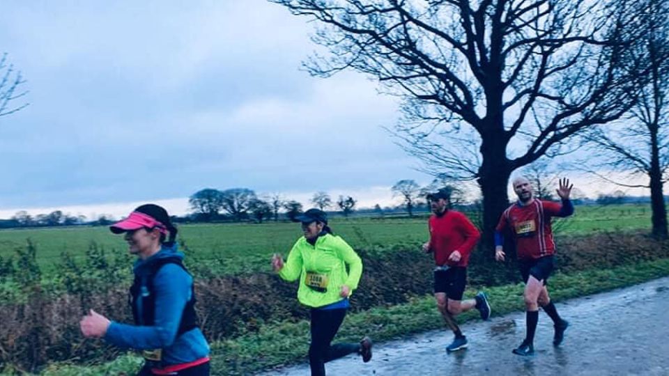 Waving through wet conditions at the Revesby Run Series