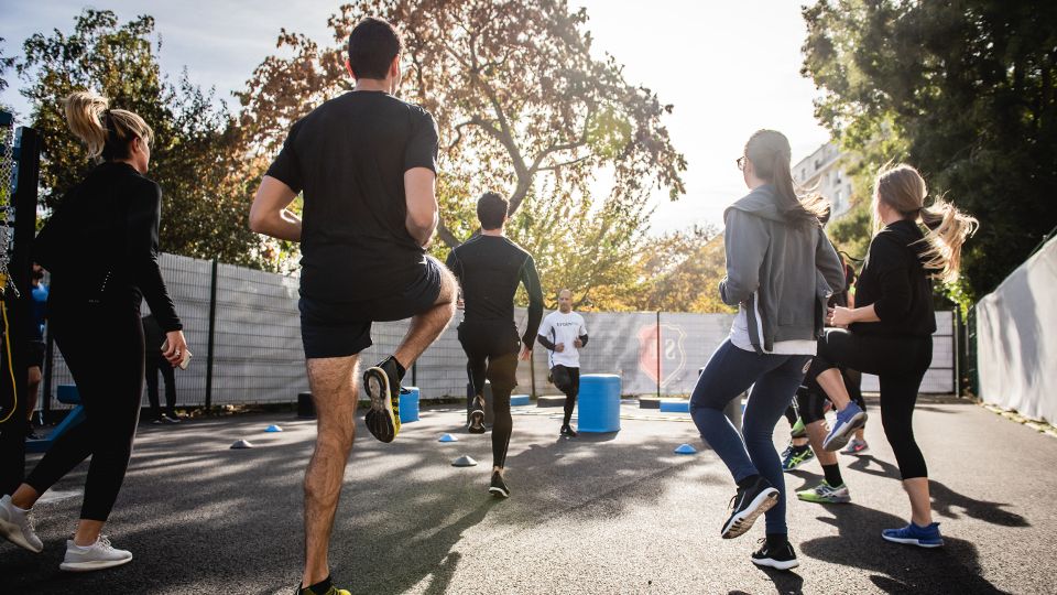 Group of runners warming up ahead of a session