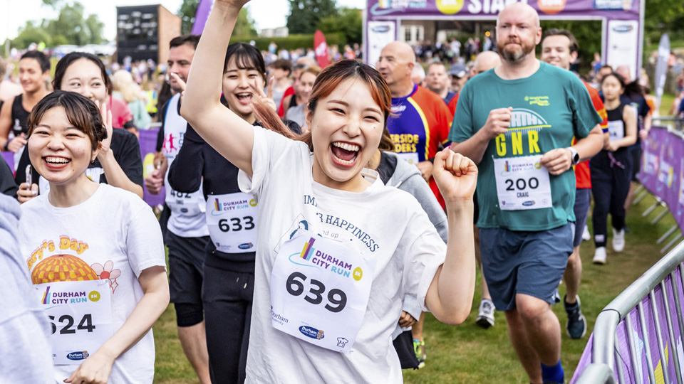 /images/2022/07/durham-city-run-happy-runner.jpg
