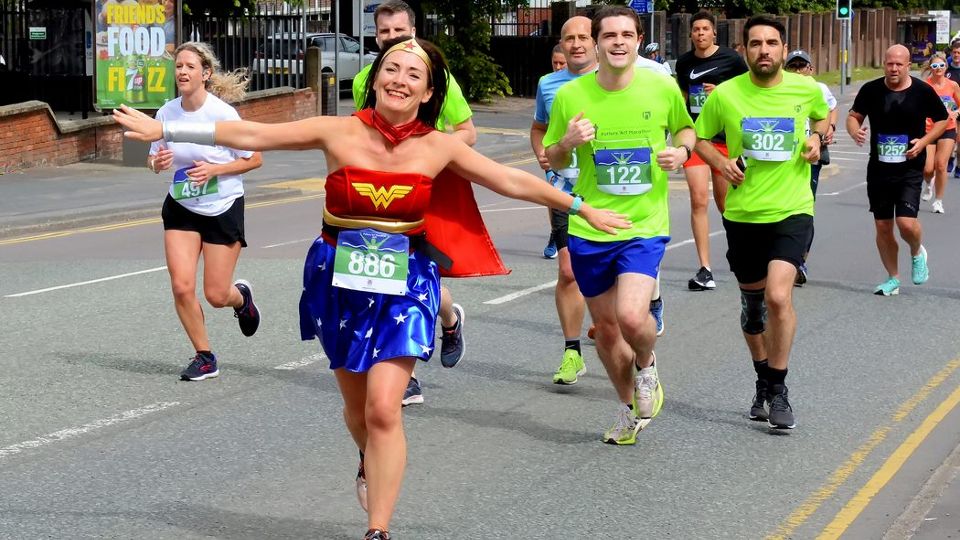 Wonder Woman powering her way up Anchor Road at the Potters 'Arf Marathon