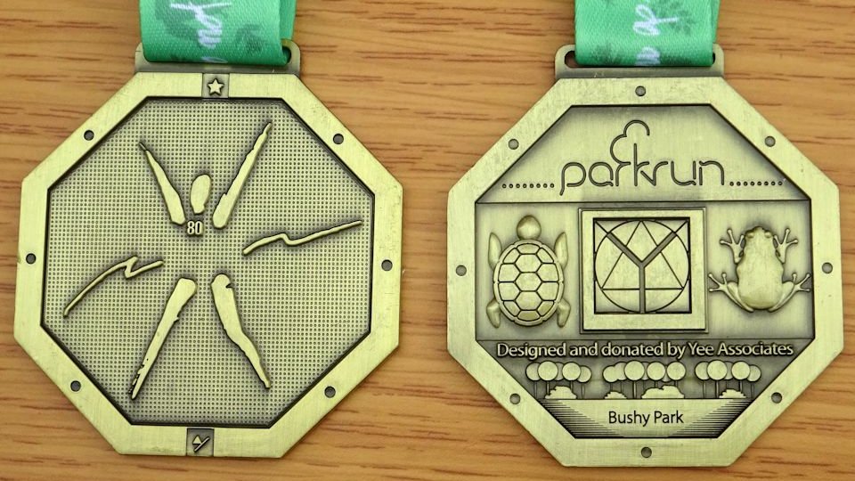 Octogenarians medal at Bushy parkrun