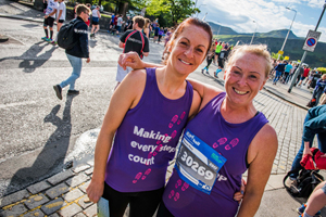 Runners in their Alzheimer Scotland vests at Edinburgh Marathon Festival