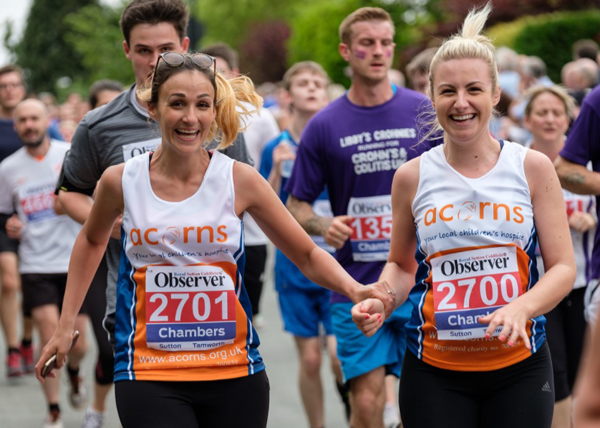 Two happy racers in Acorns T-shirts 