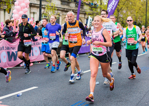 happy runner in bright Breast Cancer Now colours