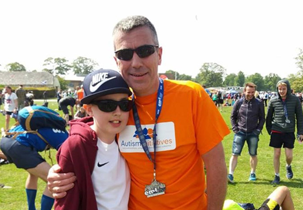 Man with son after completing Edinburgh Marathon 
