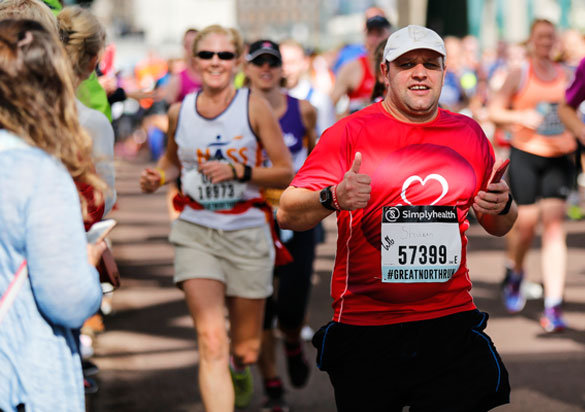 Happy runner in trademark BHF red vest