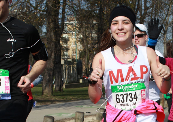 Woman running in MAP vest