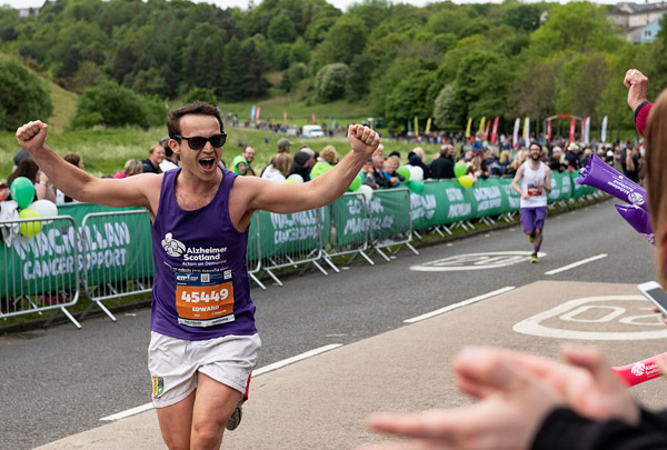 Runner with raised arms