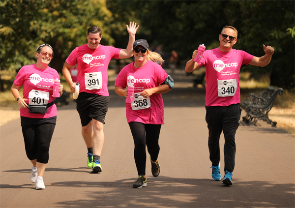 runners in pink t-shirts at Run Sutton Park