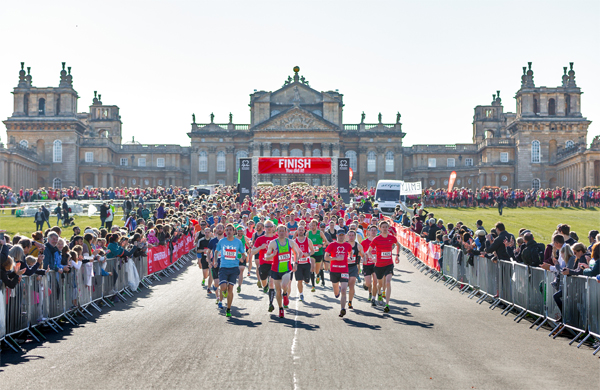 runners in the avenue in front of Blenheim Palace