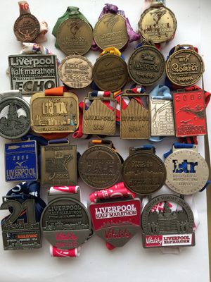 image showing a selection of Liverpool Half medals over the years