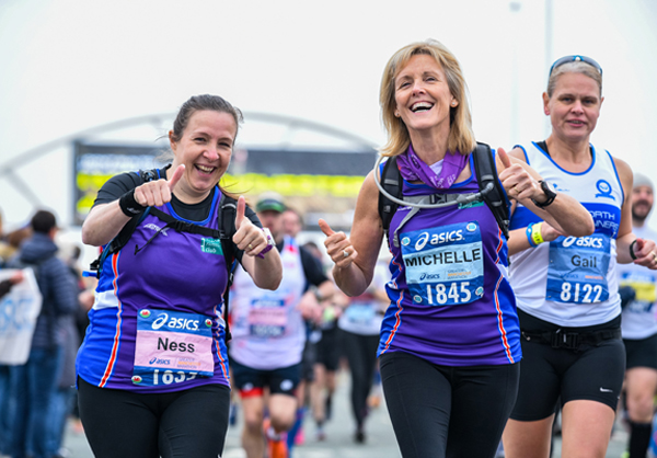 two happy ladies enjoying Manchester Marathon