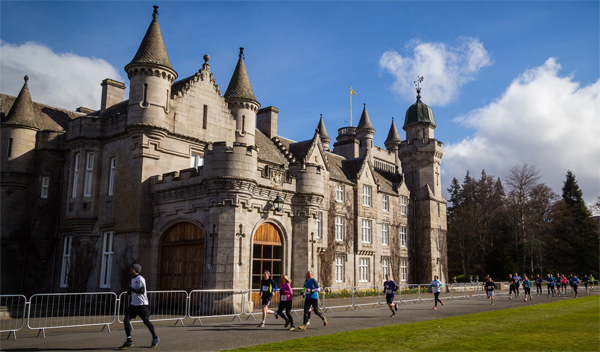 runners in front of Balmoral Castle