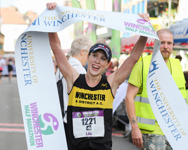 Happy lady finisher at Winchester Half Marathon 