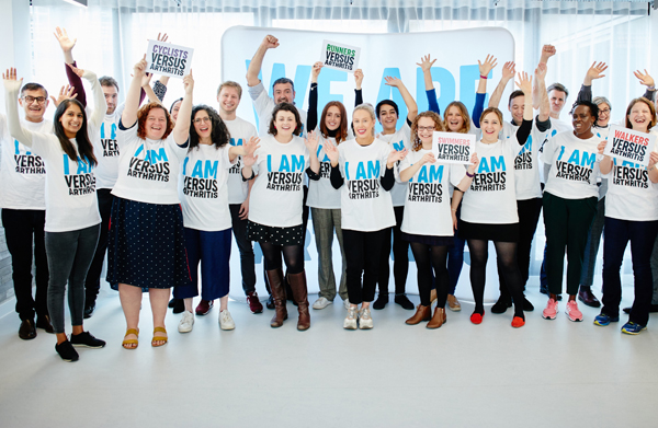 big group shot of Versus Arthritis supporters in charity T-shirts