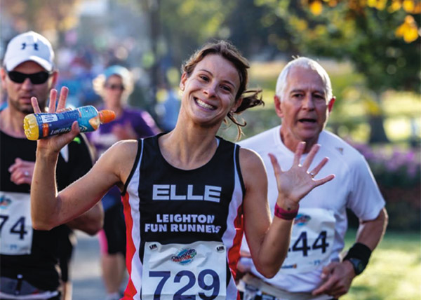 A very smiley female runner at Chelmsford Marathon