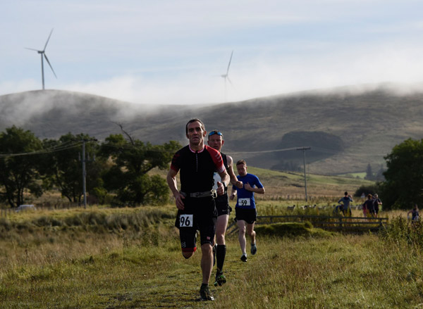 runners on a scenic part of the River Ayr way ultra