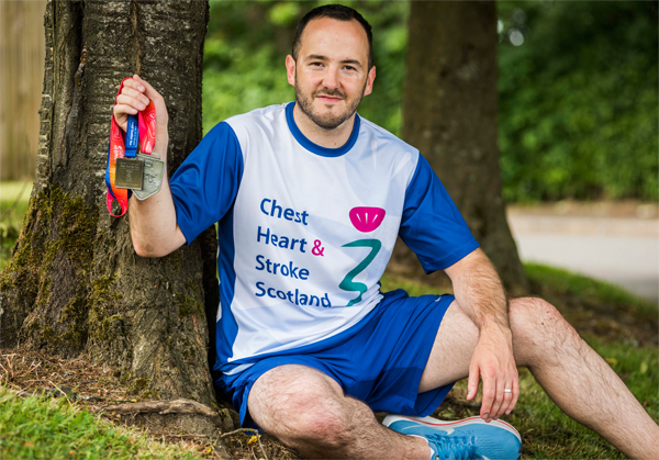 Runner in CHSS T-shirt wth medal