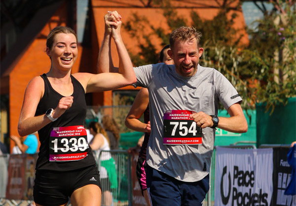 Two happy runners at the finish of Maidenhead Half