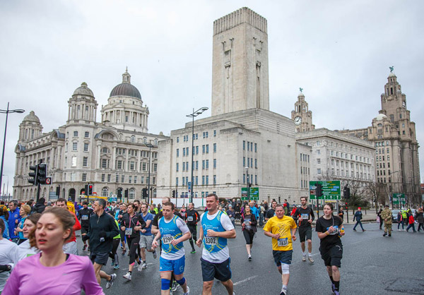 runners with great Liverpool skyline backdrop