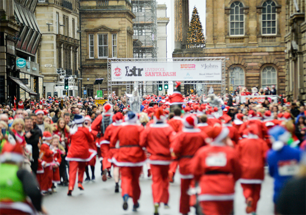 group of running Santas