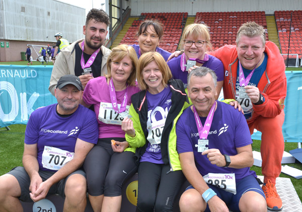 Happy runners with medals