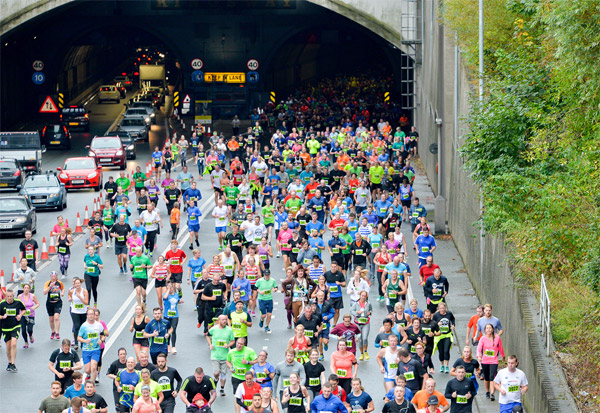 runners coming out of the Mersey Tunnel