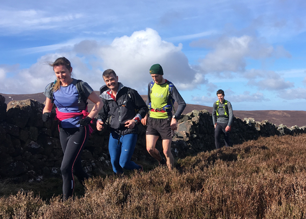 runners on the early stages of the Edinburgh Peaks run