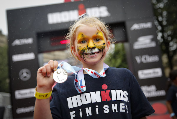 Face-painted girl at Ironman kid's event