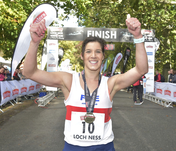 Sheena Logan clebrates after winning at Loch Ness Marathon