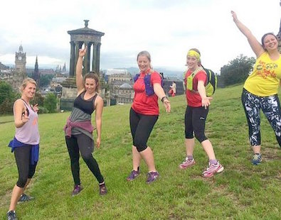happy girls in running kit on Edinburgh hill