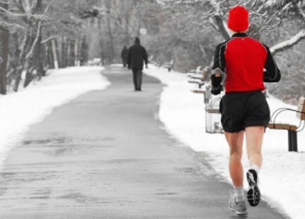 Shot of a runner with a Santa hat on a snowy day