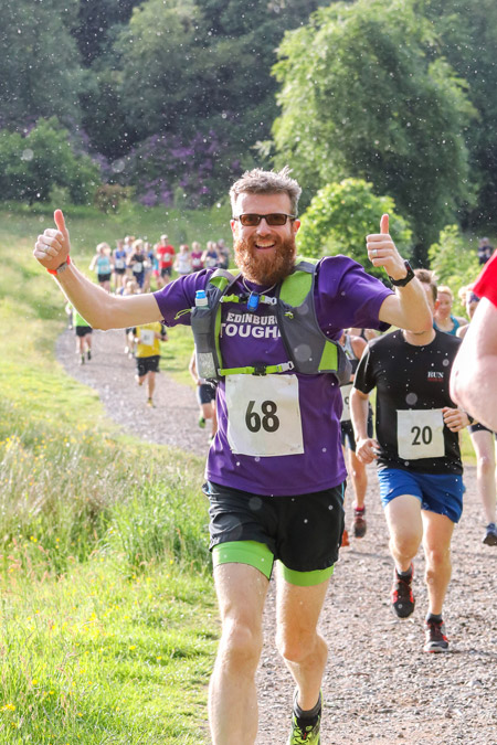 happy trail runner in Mugdock park