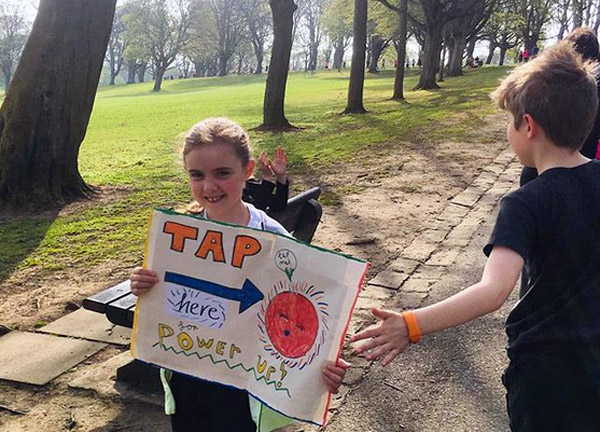 young supporter with power-up sign at Kirkcaldy Half 2019