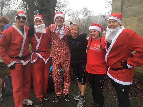 runners in Santa garb