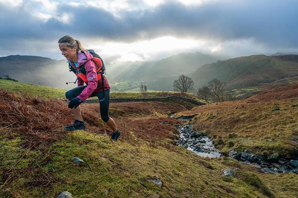 Girl runner in the hills