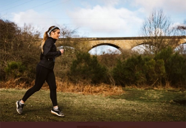 Solo female runner in the countryside