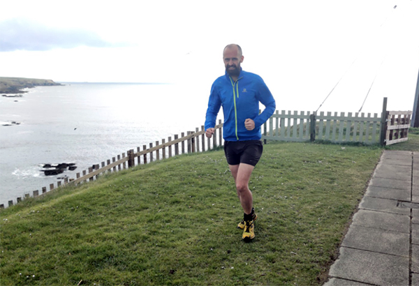 Mike Raffan running in his garden