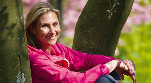 A smiling Christine outdoors